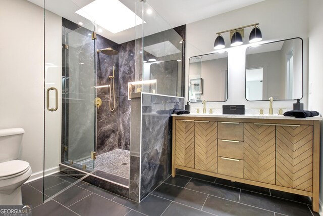 full bathroom featuring baseboards, toilet, a skylight, and a shower stall
