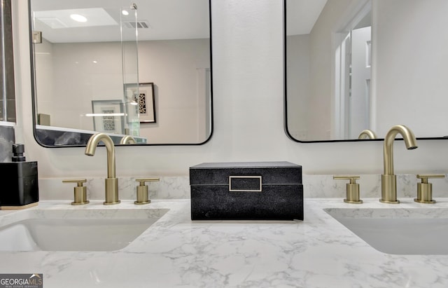 bathroom with visible vents and vanity