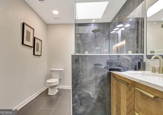 full bathroom with baseboards, a walk in shower, tile patterned flooring, and toilet