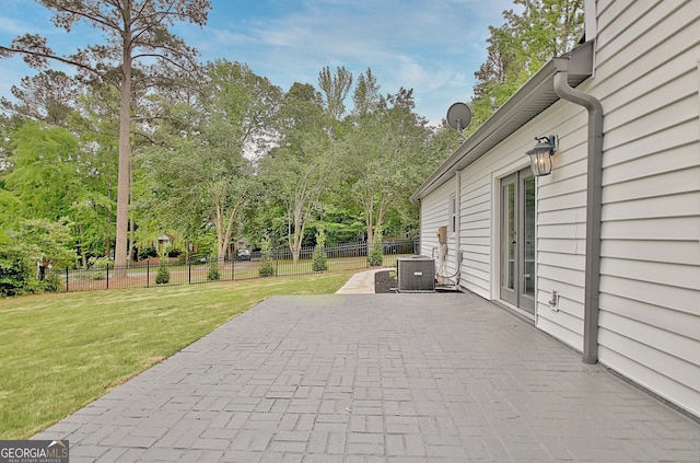 view of patio with central AC unit and fence