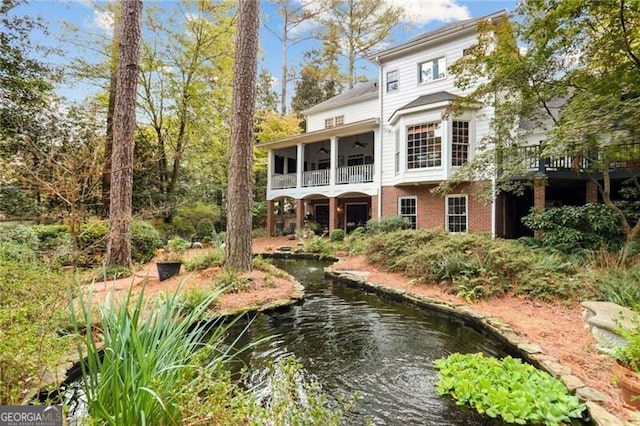 769 Hampton Pl SW, Marietta, GA 30064 - back of house with brick siding and ceiling fan