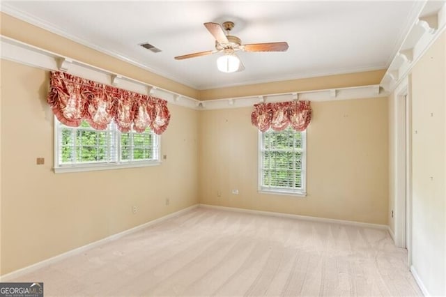 769 Hampton Pl SW, Marietta, GA 30064 - spare room with crown molding, baseboards, ceiling fan, and visible vents