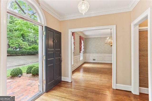 769 Hampton Pl SW, Marietta, GA 30064 - entryway with a chandelier, ornamental molding, and wood finished floors