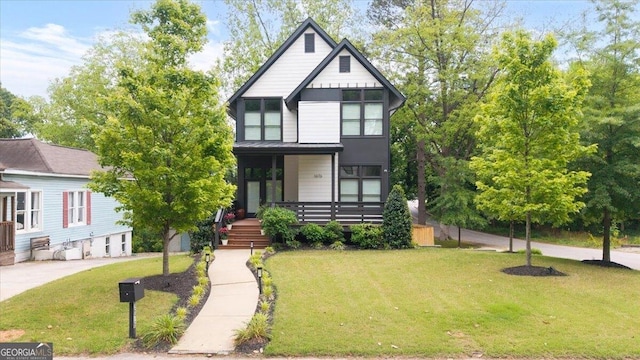 1676 Carroll Dr NW, Atlanta, GA 30318 - view of front of property featuring a porch and a front yard