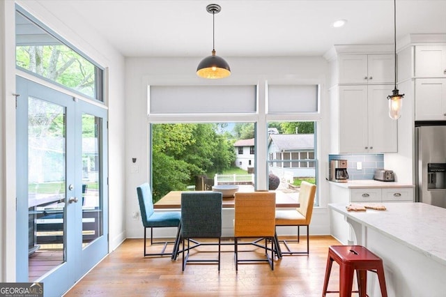 1676 Carroll Dr NW, Atlanta, GA 30318 - dining space featuring french doors, recessed lighting, and light wood-style floors