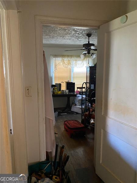 2689 Knox St, Atlanta, GA 30317 - doorway with a ceiling fan and wood finished floors