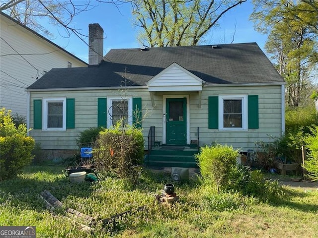 2689 Knox St, Atlanta, GA 30317 - view of front of home with a shingled roof and a chimney