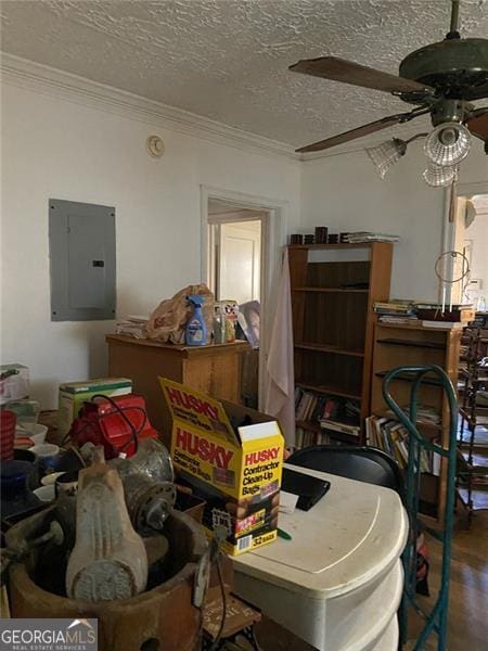 2689 Knox St, Atlanta, GA 30317 - interior space featuring ornamental molding, wood finished floors, ceiling fan, a textured ceiling, and electric panel