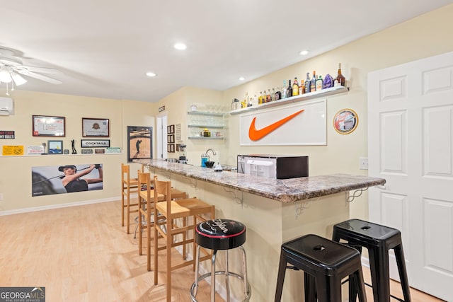 3845 New Salem Ct, Cumming, GA 30040 - indoor wet bar featuring a ceiling fan, light wood finished floors, recessed lighting, and a wall mounted air conditioner