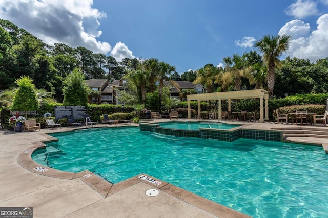 5301 Walden Park Dr Unit 5301, Savannah, GA 31410 - community pool with a community hot tub, a patio, and view of wooded area