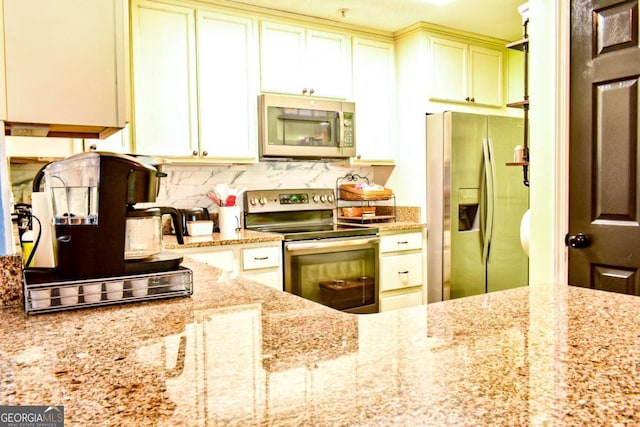 5301 Walden Park Dr Unit 5301, Savannah, GA 31410 - kitchen with appliances with stainless steel finishes, decorative backsplash, and light stone countertops