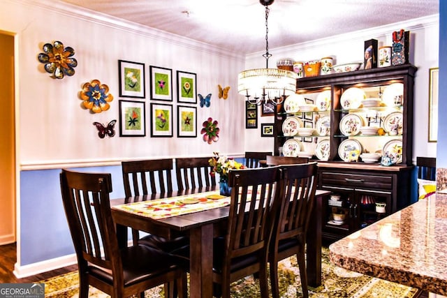 5301 Walden Park Dr Unit 5301, Savannah, GA 31410 - dining area with wood finished floors, a chandelier, and crown molding