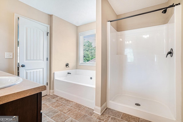 full bathroom with baseboards, a bath, a shower, and vanity