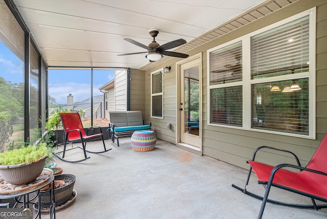 sunroom featuring a ceiling fan