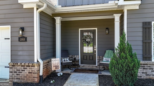 property entrance featuring covered porch