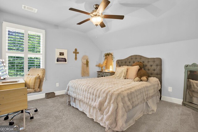 bedroom with visible vents, carpet, baseboards, and vaulted ceiling