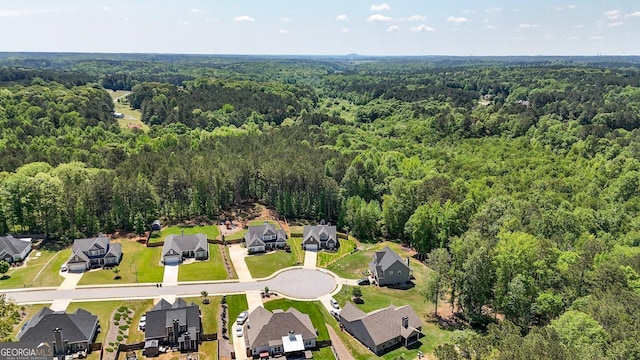 aerial view featuring a residential view and a forest view