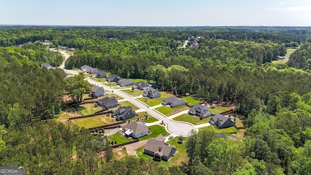 bird's eye view with a forest view and a residential view