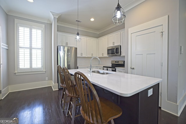 4143 N Swann St, Covington, GA 30014 - kitchen with appliances with stainless steel finishes, a sink, white cabinetry, baseboards, and decorative backsplash
