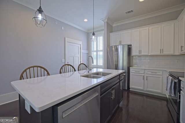 4143 N Swann St, Covington, GA 30014 - kitchen featuring white cabinets, a sink, a kitchen island with sink, stainless steel appliances, and visible vents