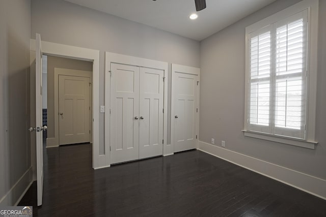 4143 N Swann St, Covington, GA 30014 - unfurnished bedroom with ceiling fan, baseboards, a closet, recessed lighting, and dark wood-type flooring