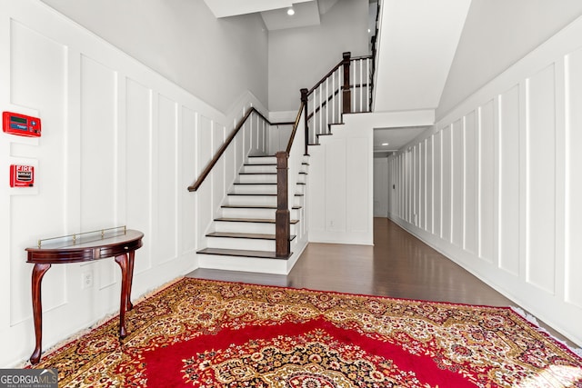 4143 N Swann St, Covington, GA 30014 - entryway featuring wood finished floors, stairway, and a decorative wall