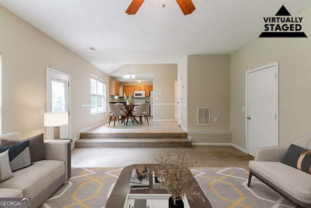 4870 Heather Mill Trce, Snellville, GA 30039 - living room with visible vents, baseboards, ceiling fan with notable chandelier, and light carpet