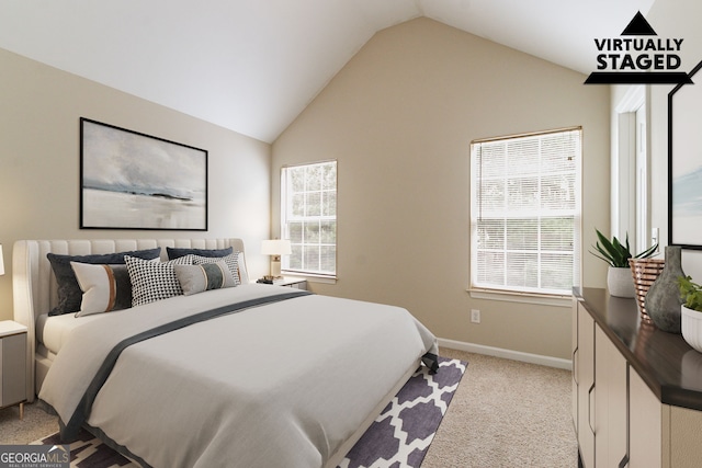4870 Heather Mill Trce, Snellville, GA 30039 - bedroom featuring multiple windows, light carpet, baseboards, and lofted ceiling