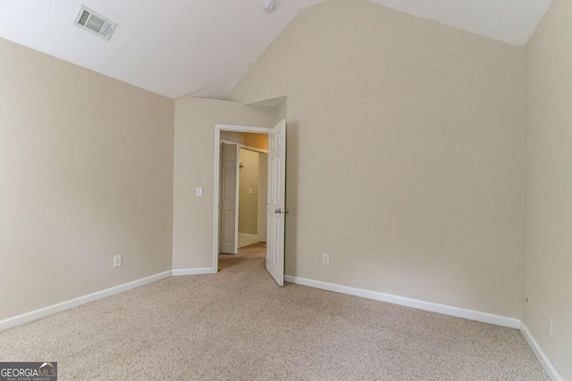 4870 Heather Mill Trce, Snellville, GA 30039 - unfurnished room with vaulted ceiling, visible vents, baseboards, and light carpet