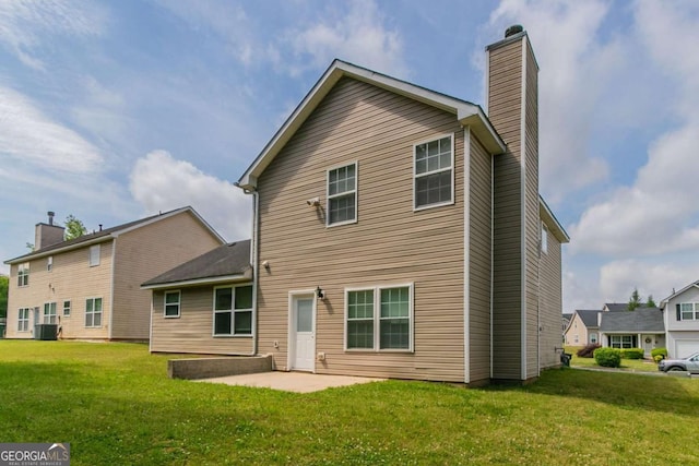 4870 Heather Mill Trce, Snellville, GA 30039 - back of house with a patio, a chimney, and a lawn
