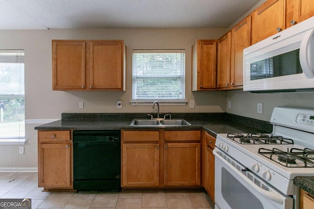 4870 Heather Mill Trce, Snellville, GA 30039 - kitchen featuring a sink, white appliances, dark countertops, and light tile patterned floors