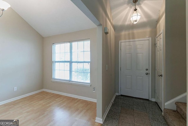 4870 Heather Mill Trce, Snellville, GA 30039 - entrance foyer featuring vaulted ceiling, stairway, and baseboards