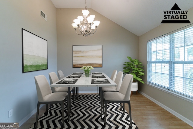 4870 Heather Mill Trce, Snellville, GA 30039 - dining room with plenty of natural light, baseboards, visible vents, a chandelier, and light wood-type flooring