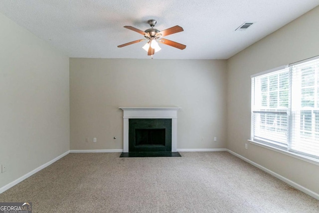 4870 Heather Mill Trce, Snellville, GA 30039 - unfurnished living room featuring ceiling fan, a fireplace with flush hearth, visible vents, and carpet floors