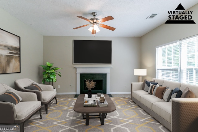 4870 Heather Mill Trce, Snellville, GA 30039 - living area featuring baseboards, visible vents, ceiling fan, a fireplace with flush hearth, and carpet floors