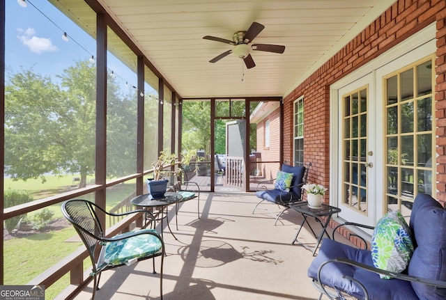 sunroom with a healthy amount of sunlight and ceiling fan