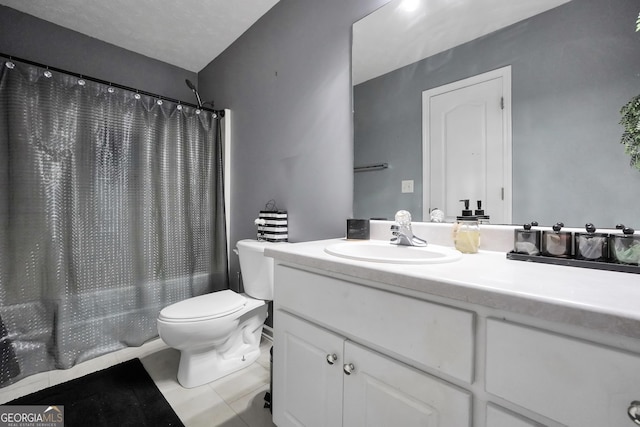 full bath featuring vanity, shower / bathtub combination with curtain, tile patterned floors, and toilet