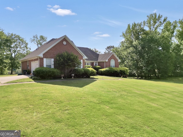 view of front facade with brick siding, a front lawn, an attached garage, and concrete driveway