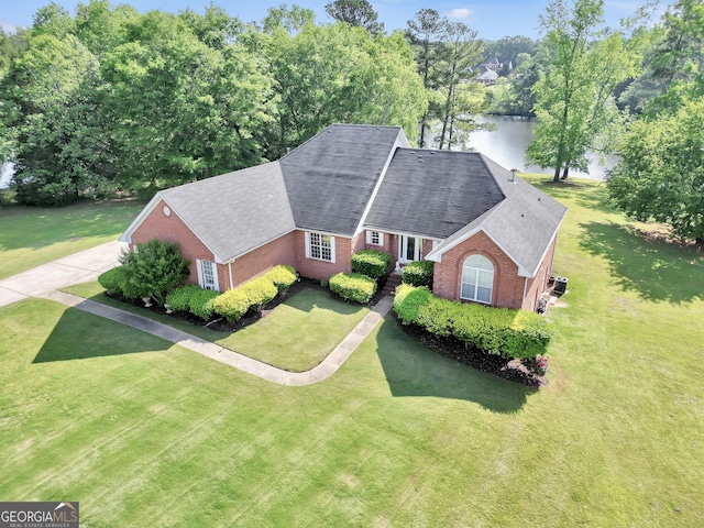 birds eye view of property with a water view