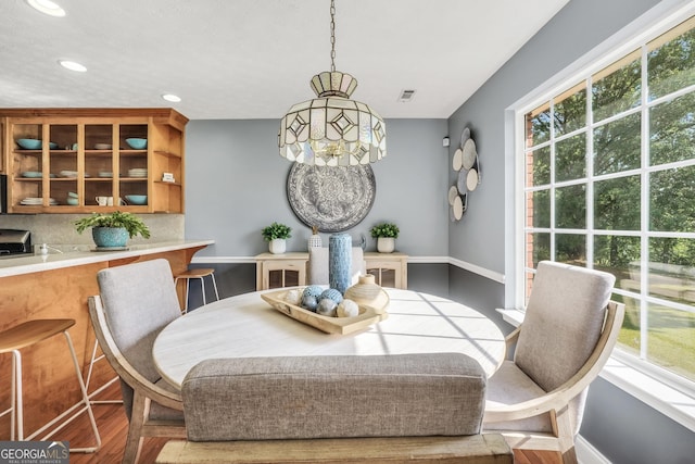 dining space with visible vents, recessed lighting, baseboards, and wood finished floors