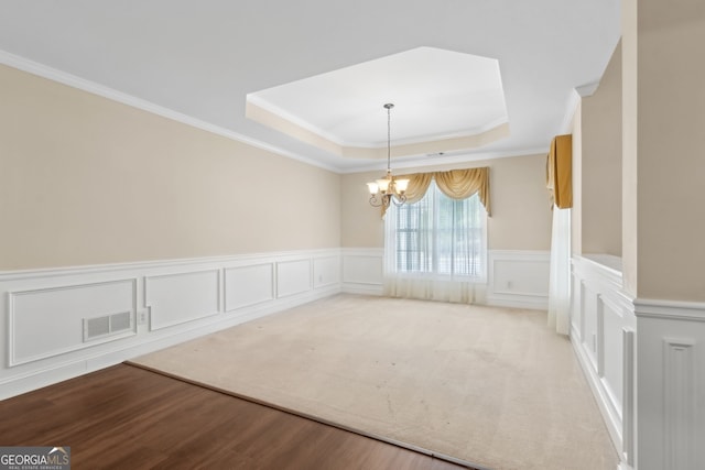 2055 Hickory Station Cir, Snellville, GA 30078 - unfurnished dining area featuring visible vents, crown molding, a tray ceiling, and an inviting chandelier