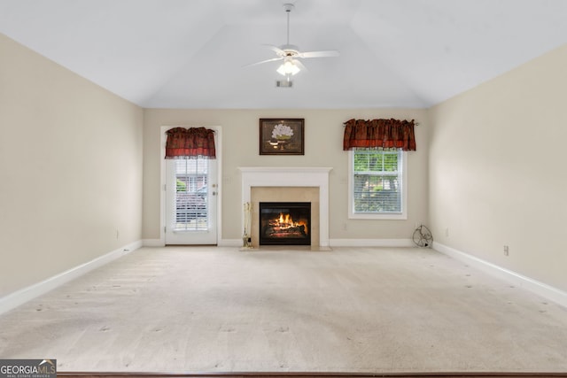 2055 Hickory Station Cir, Snellville, GA 30078 - unfurnished living room featuring carpet, ceiling fan, a healthy amount of sunlight, and a premium fireplace
