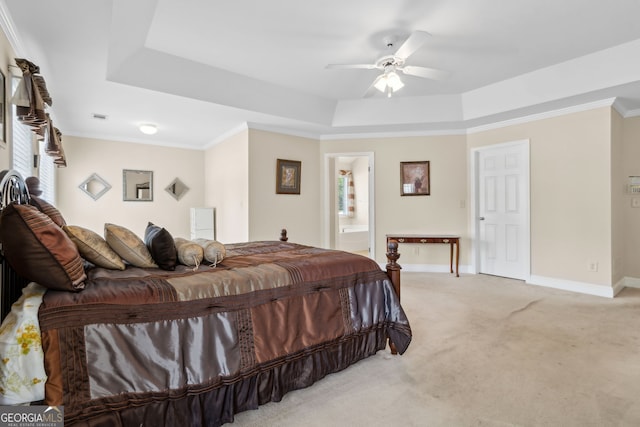 2055 Hickory Station Cir, Snellville, GA 30078 - bedroom featuring light carpet, baseboards, ensuite bathroom, ceiling fan, and a raised ceiling