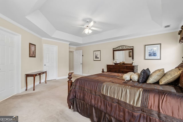 2055 Hickory Station Cir, Snellville, GA 30078 - bedroom featuring light colored carpet, baseboards, a tray ceiling, visible vents, and ornamental molding