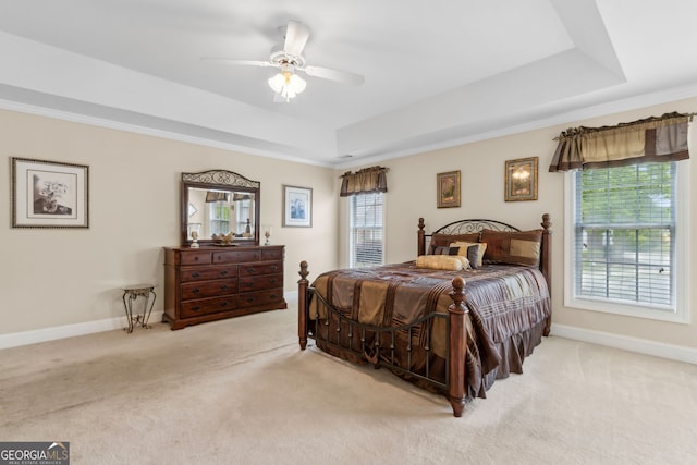 2055 Hickory Station Cir, Snellville, GA 30078 - bedroom with a raised ceiling, baseboards, a ceiling fan, and light colored carpet