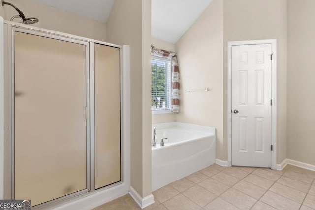 2055 Hickory Station Cir, Snellville, GA 30078 - bathroom with tile patterned flooring, a stall shower, baseboards, and a bath