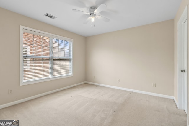 2055 Hickory Station Cir, Snellville, GA 30078 - spare room with baseboards, a ceiling fan, light colored carpet, and visible vents