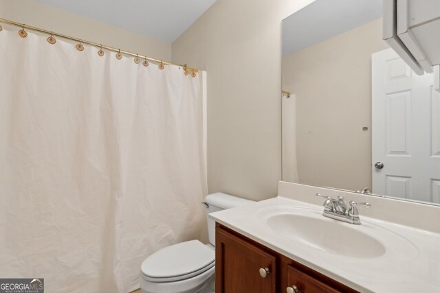 2055 Hickory Station Cir, Snellville, GA 30078 - full bathroom featuring toilet, curtained shower, and vanity