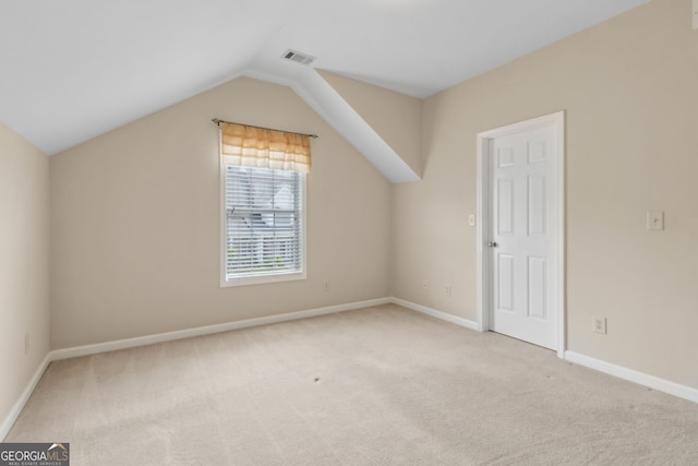 2055 Hickory Station Cir, Snellville, GA 30078 - additional living space featuring carpet floors, baseboards, vaulted ceiling, and visible vents