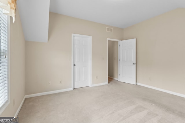2055 Hickory Station Cir, Snellville, GA 30078 - unfurnished bedroom featuring visible vents, baseboards, and light carpet